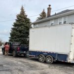 A large white trailer is full of gifts to be delivered to underserved youth.